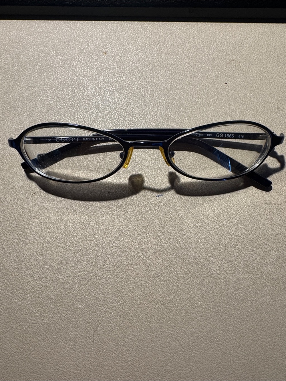 Gucci Black Oval Glasses with Gold Nose Pads